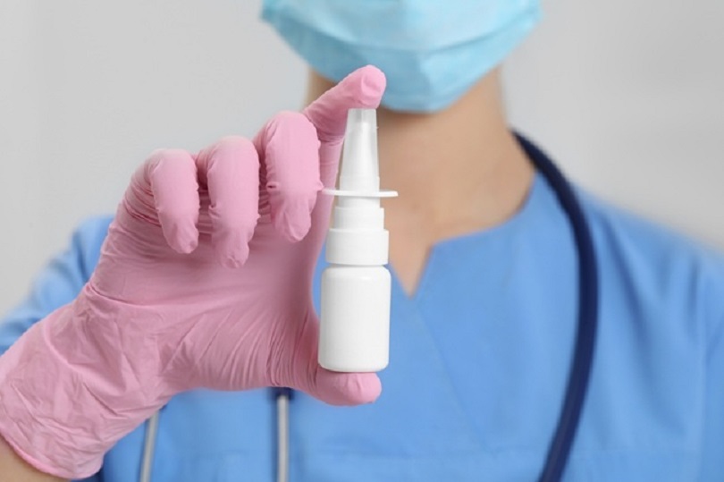 Doctor,Holding,Nasal,Spray,On,White,Background,,Closeup